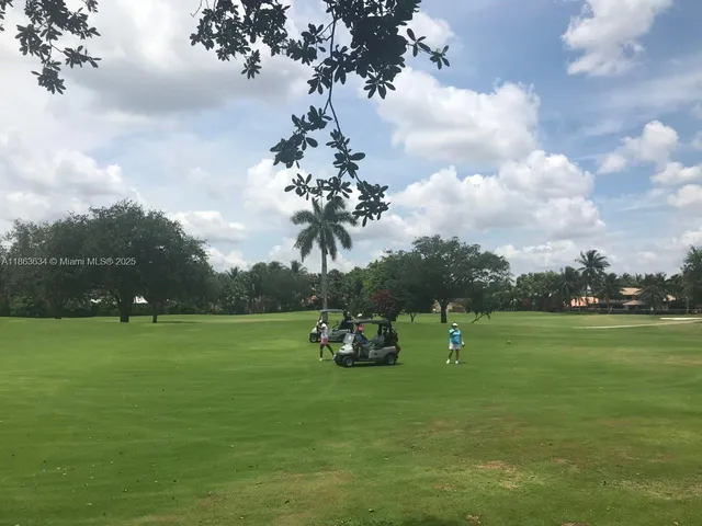a view of a big yard with a fountain