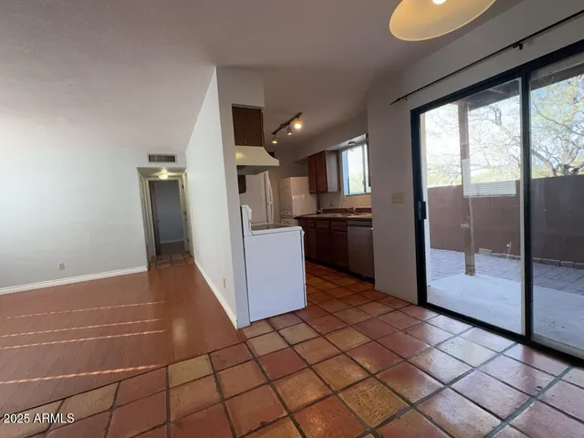 a kitchen with stainless steel appliances a refrigerator and a sink