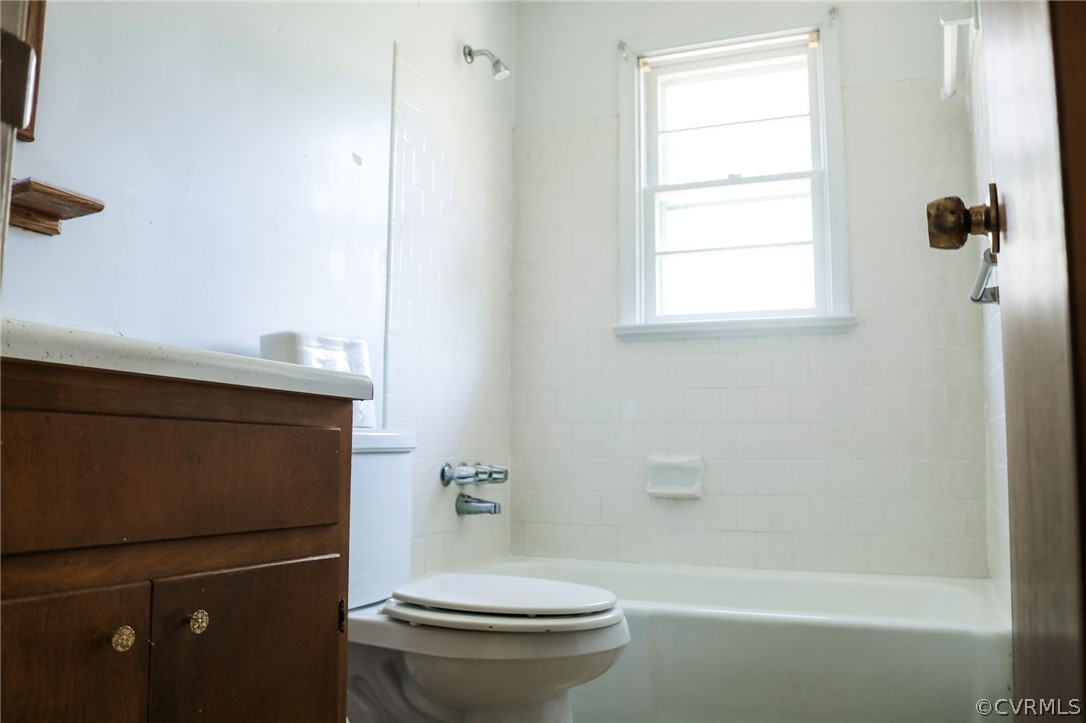 5601 Qualla Road Chesterfield, VA 23832 - Photo 13 of 24 a bathroom with a granite countertop toilet a sink and a bathtub