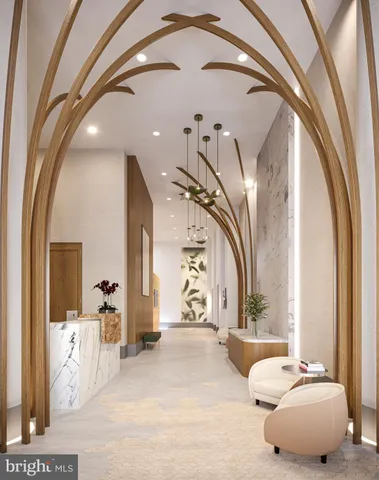 a spacious bedroom with a large bed and a chandelier