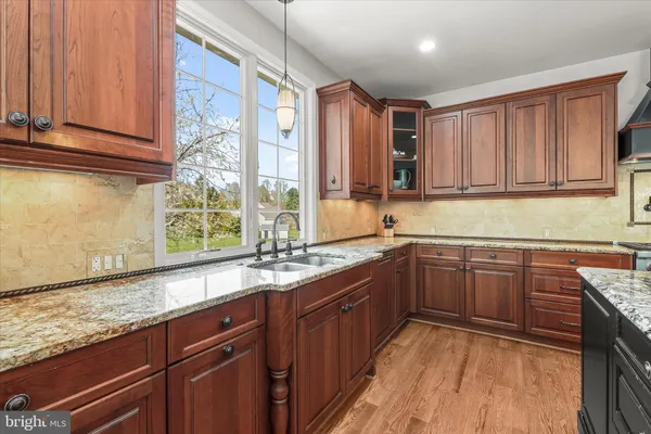 a living room with furniture and a dining table with kitchen view