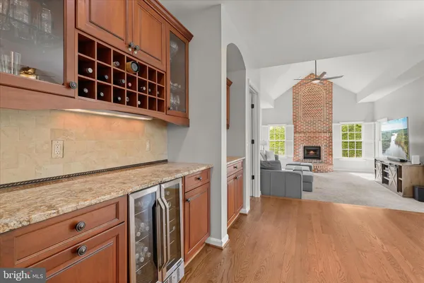 a spacious bedroom with a bed and a dresser