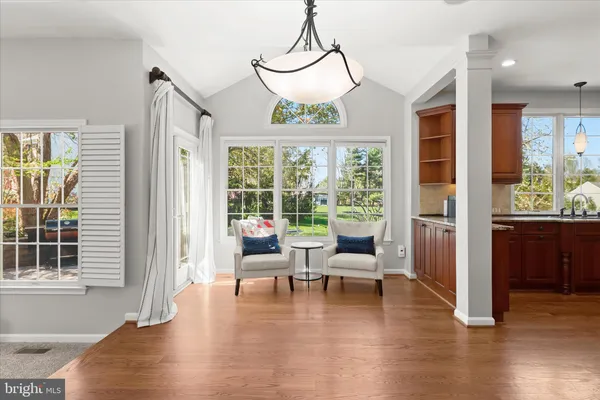 a spacious bedroom with a bed and a dresser