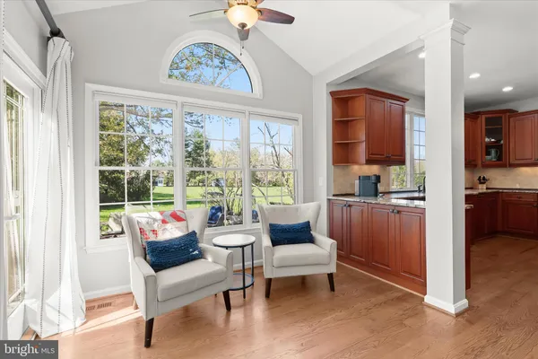 a spacious bedroom with a bed and a dresser