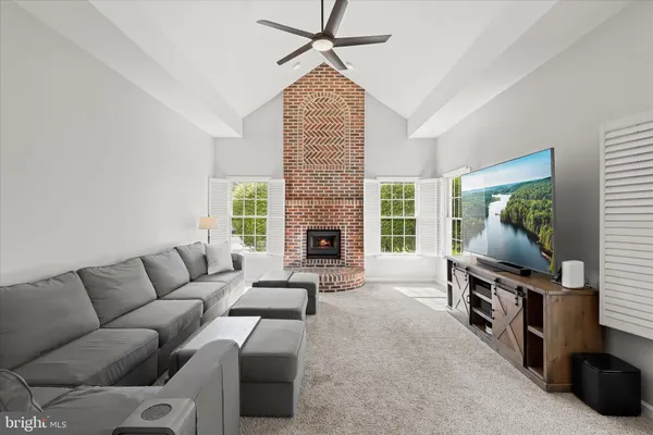 a bathroom with a double vanity sink toilet mirror and bathtub