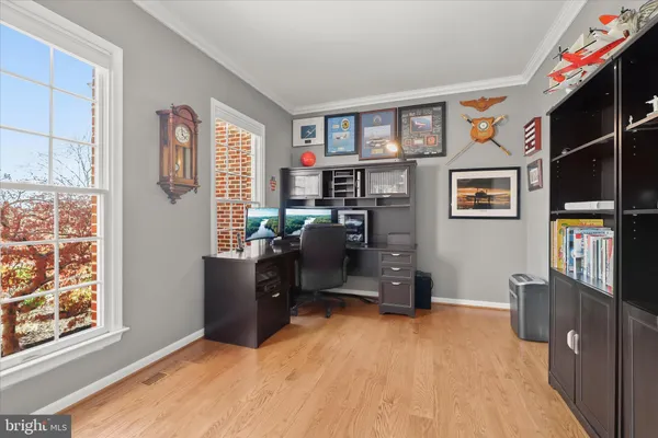 a spacious bedroom with a bed and a cabinets