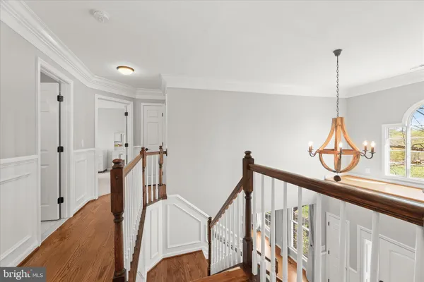 a kitchen with stainless steel appliances kitchen island granite countertop dining table chair and a refrigerator