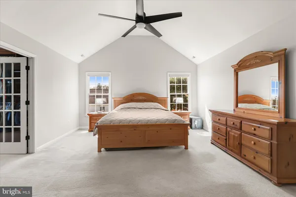 a view of a room with furniture and a window