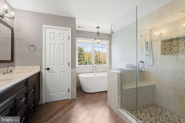 a view of a patio with table and chairs under an umbrella
