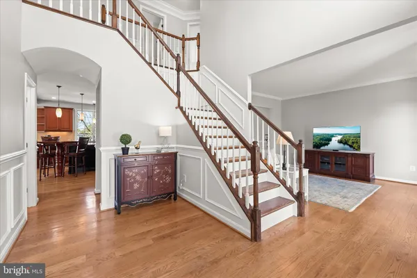 a bedroom with furniture and a wooden floor