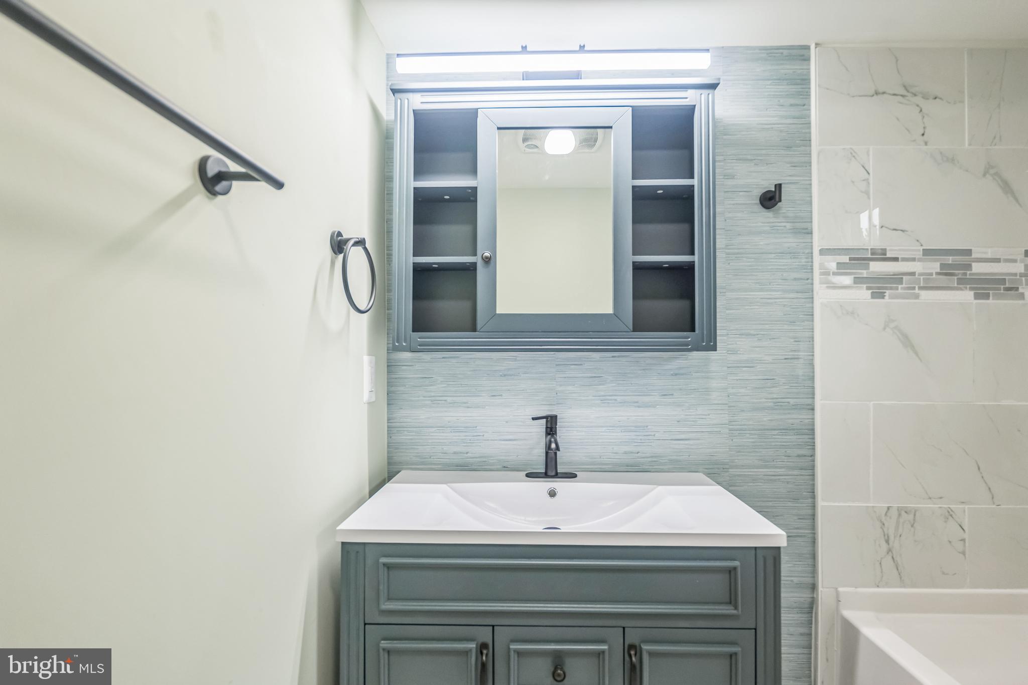 413 Bowleys Quarters Road Middle River, MD 21220 - Photo 25 of 38 a bathroom with a sink and a mirror