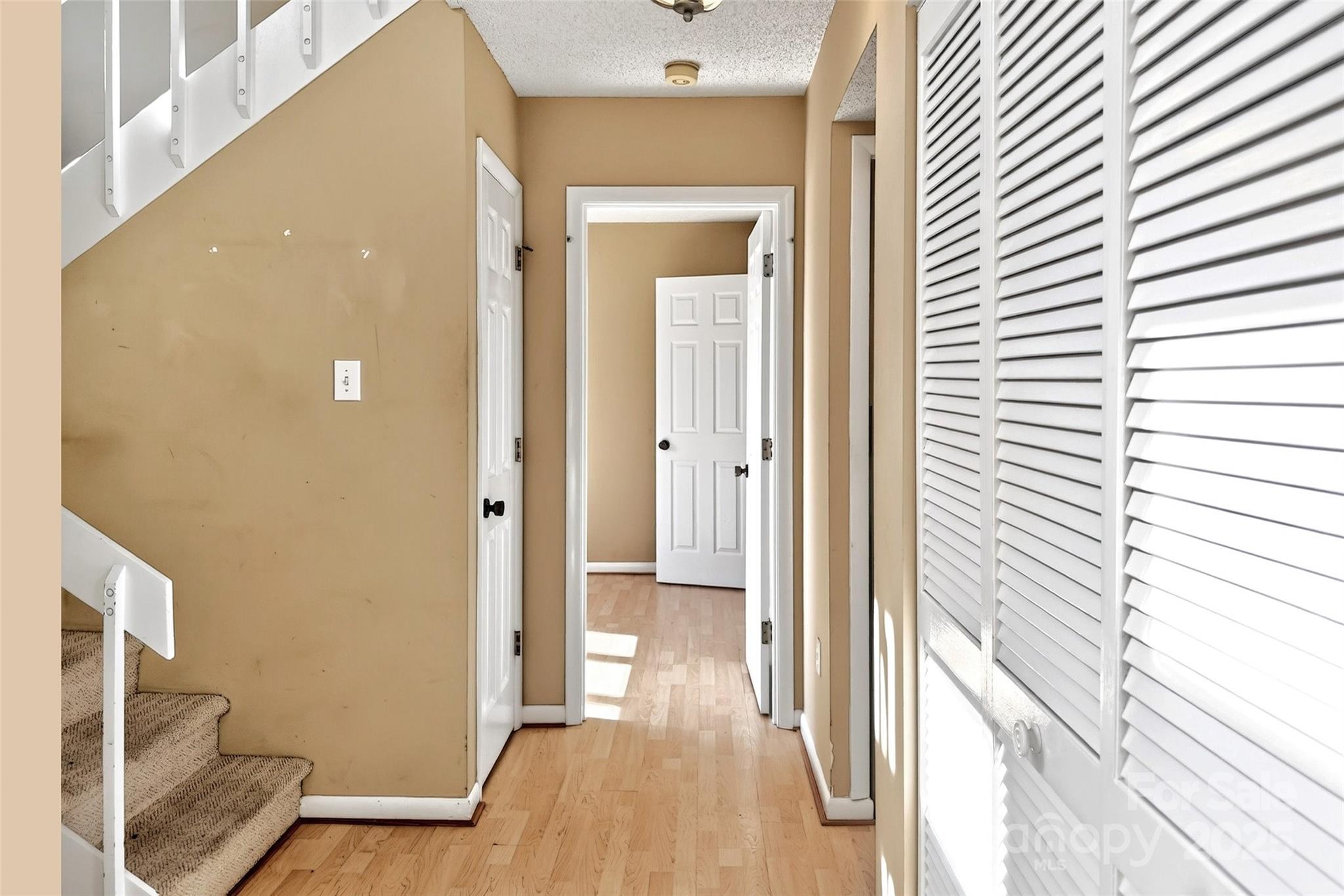 3 B Lynx Drive Black Mountain, NC 28711 - Photo 21 of 35 a view of a hallway with wooden floor and staircase