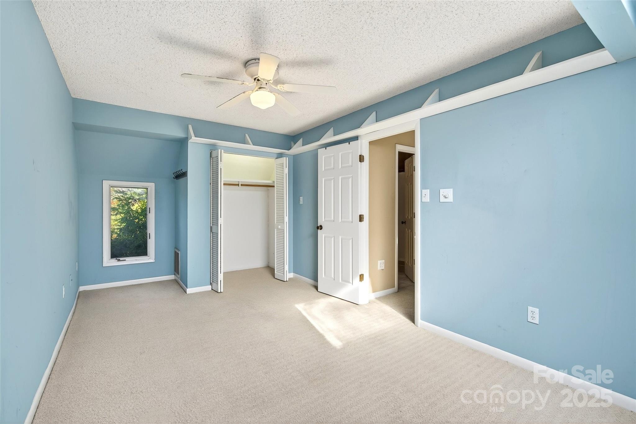 3 B Lynx Drive Black Mountain, NC 28711 - Photo 22 of 35 a view of a big room with closet and chandelier fan