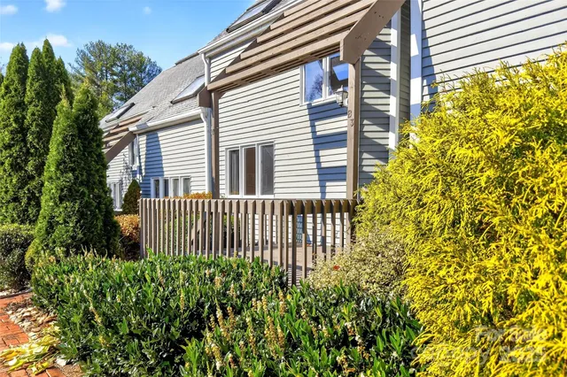 a view of a house with a small yard