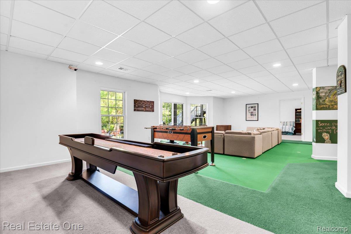 33850 Braebury Ridge Farmington, MI 48331 - Photo 50 of 85 Spacious recreation room featuring recessed lighting, a drop ceiling, and multiple window exposures