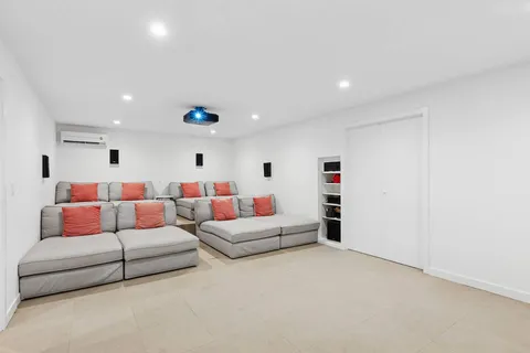 a living room with furniture and white walls