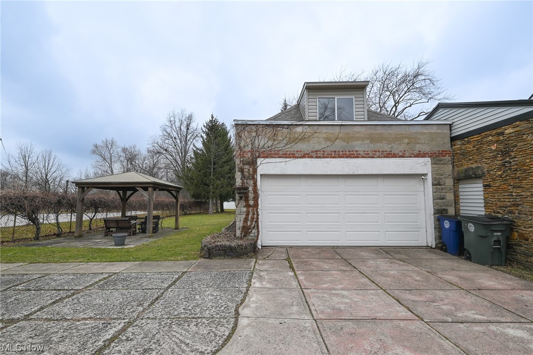 4436 Ridge Road Brooklyn, OH 44144 - Photo 3 of 33 Garage and sandstone patio with gazebo