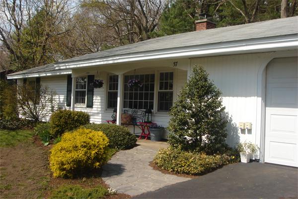 57 Eaton Road Framingham, MA 01701 - Photo 2 of 17 a front view of a house with garden