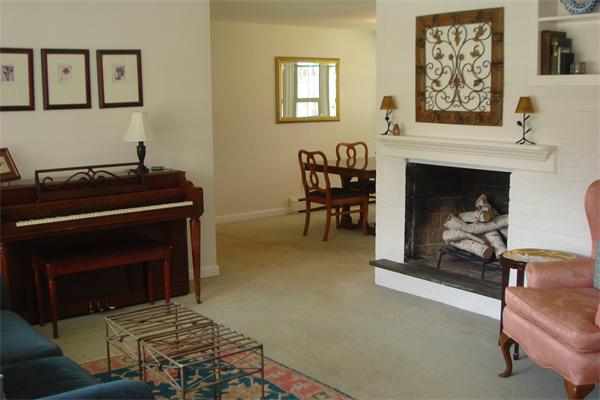 57 Eaton Road Framingham, MA 01701 - Photo 3 of 17 a living room with furniture and a fireplace