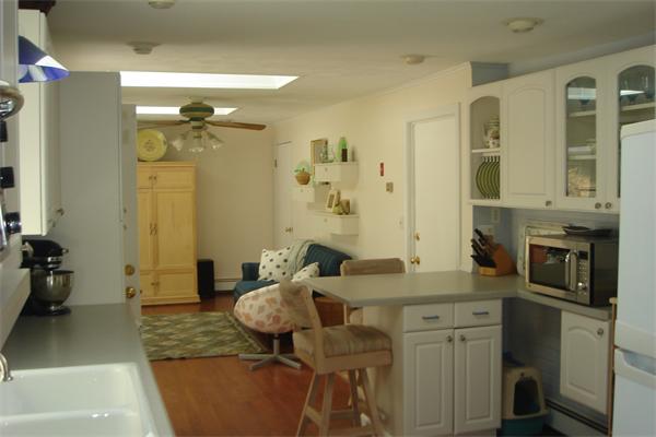 57 Eaton Road Framingham, MA 01701 - Photo 6 of 17 a bathroom with a granite countertop sink a toilet and shower