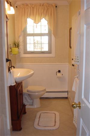 57 Eaton Road Framingham, MA 01701 - Photo 8 of 17 a bathroom with a toilet a sink and a window