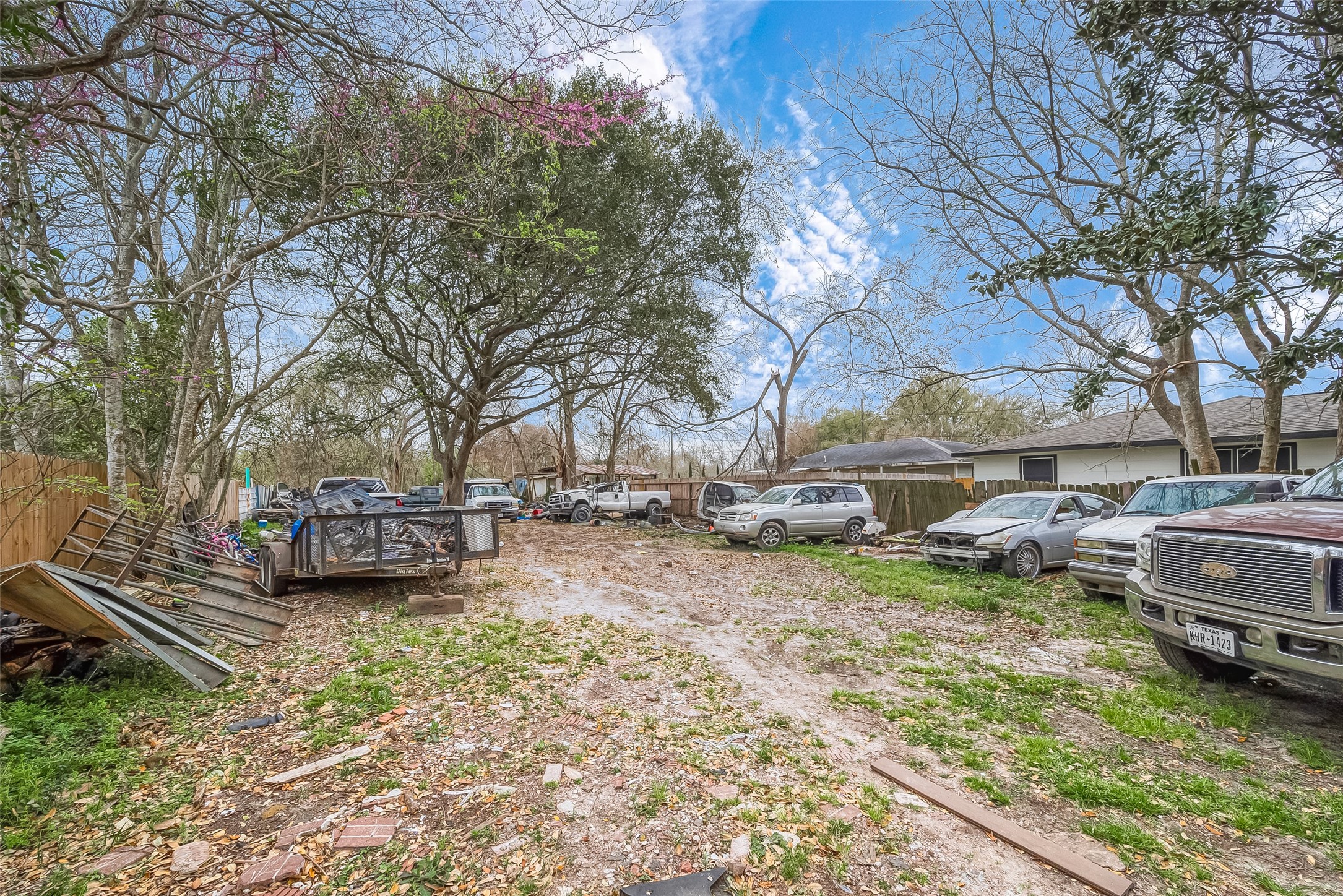 5206 Denmark Street Houston, TX 77016 - Photo 4 of 17 a view of a house with cars parked in a yard