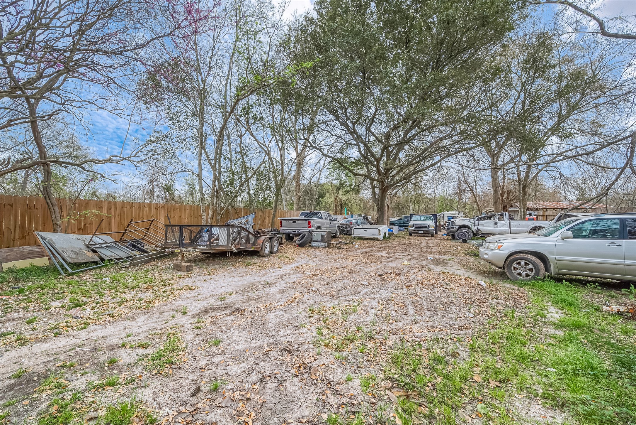 5206 Denmark Street Houston, TX 77016 - Photo 5 of 17 a view of a yard with a cars parked in front of it