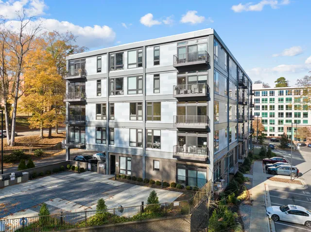 a front view of a building with street view and glass windows