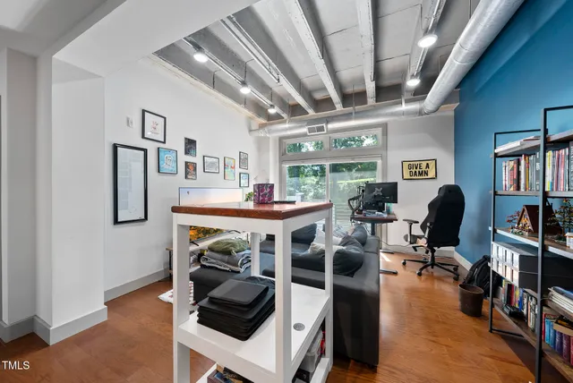 a bedroom with furniture and a gym equipment