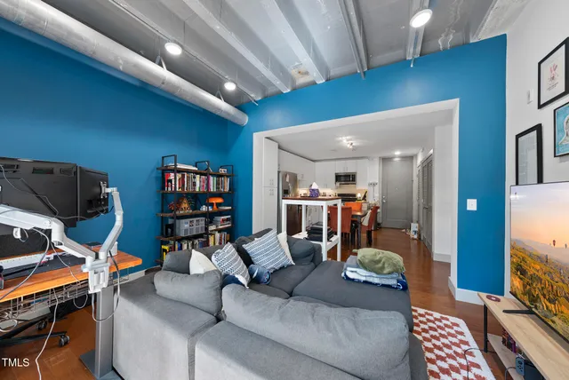a living room with furniture and a flat screen tv