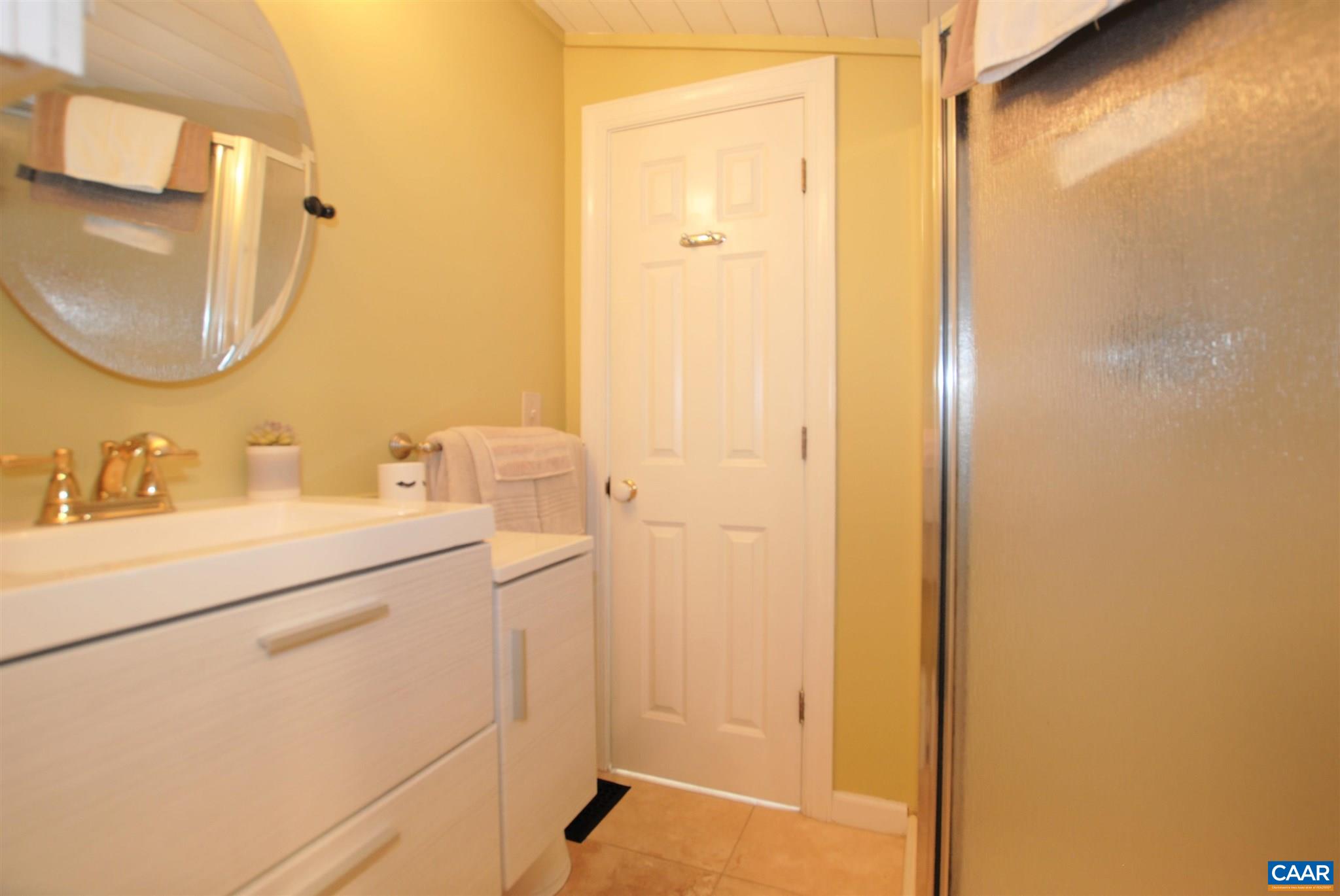 358 Fredericksburg Road Ruckersville, VA 22968 - Photo 12 of 23 a bathroom with a sink and a mirror