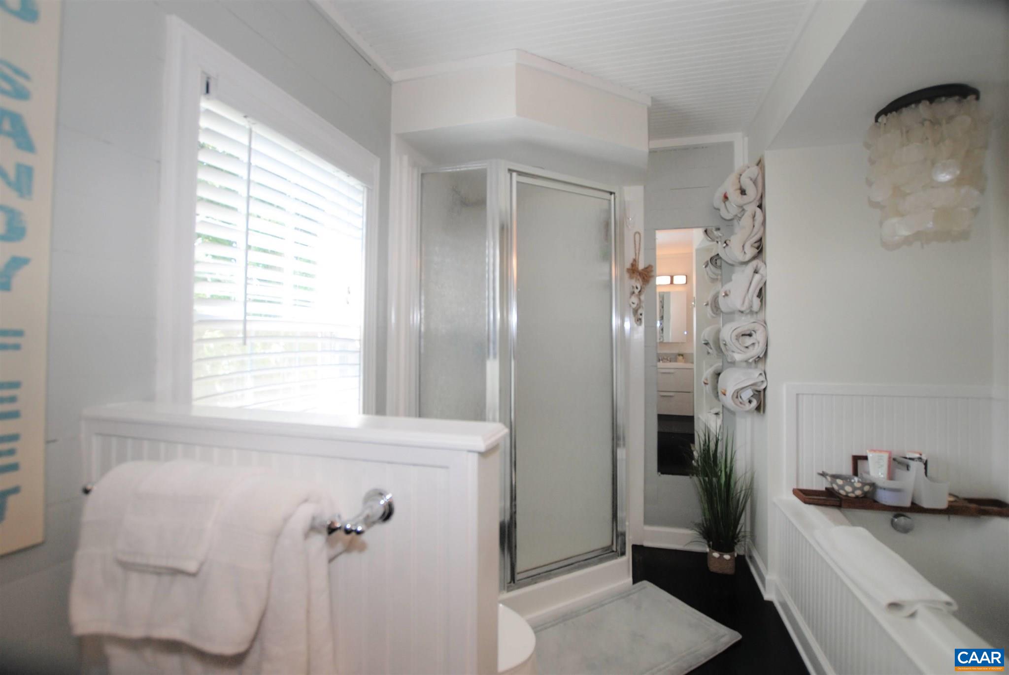 358 Fredericksburg Road Ruckersville, VA 22968 - Photo 14 of 23 a bathroom with a sink toilet and shower