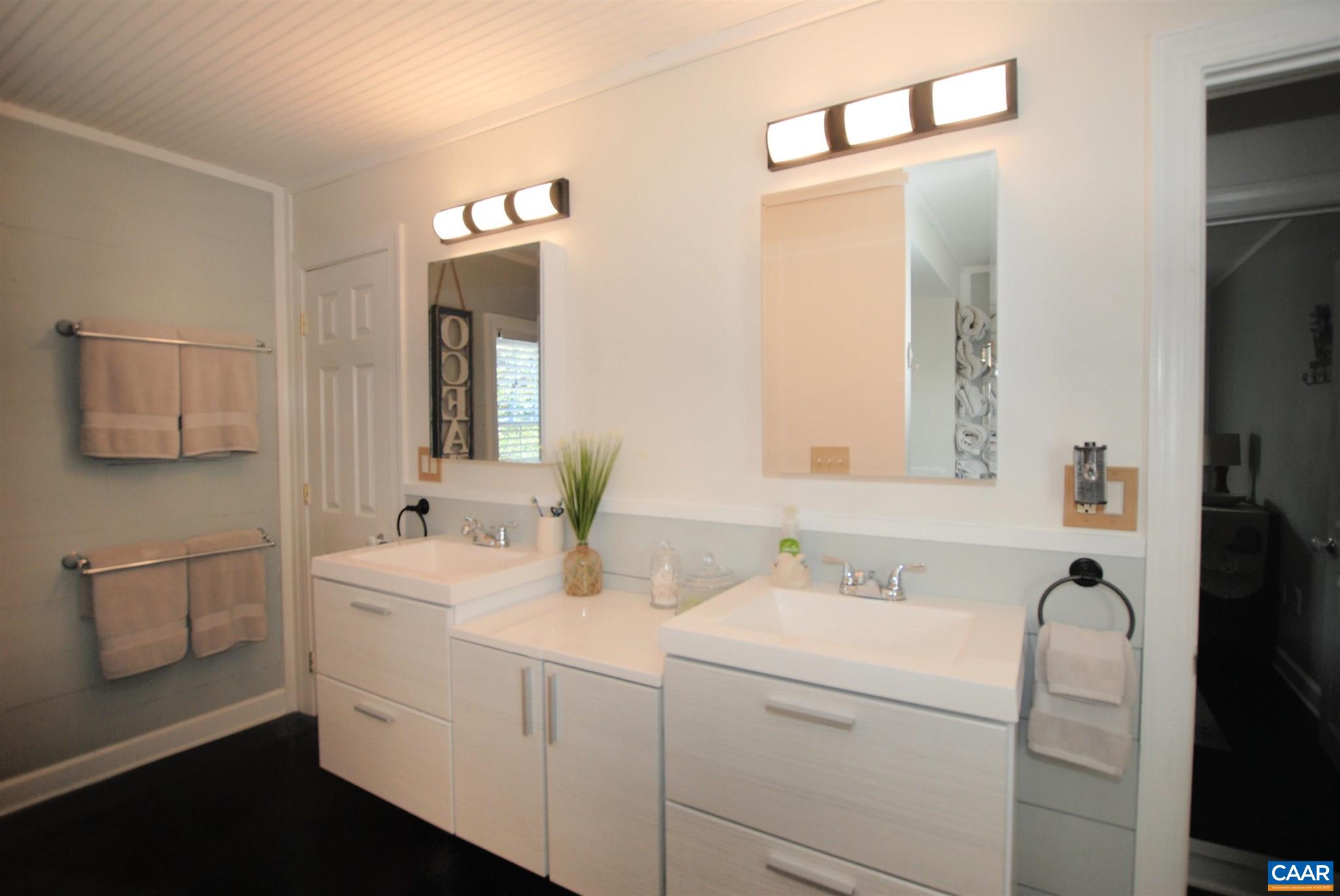 358 Fredericksburg Road Ruckersville, VA 22968 - Photo 15 of 23 a bathroom with a sink and a mirror