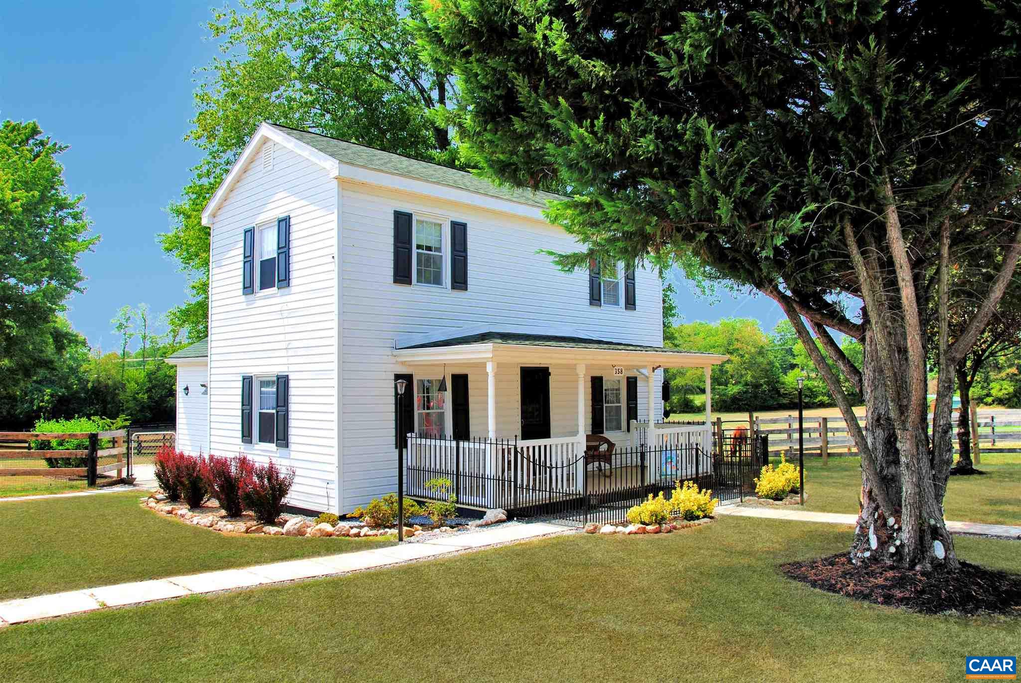 358 Fredericksburg Road Ruckersville, VA 22968 - Photo 23 of 23 a backyard of a house with yard and outdoor seating