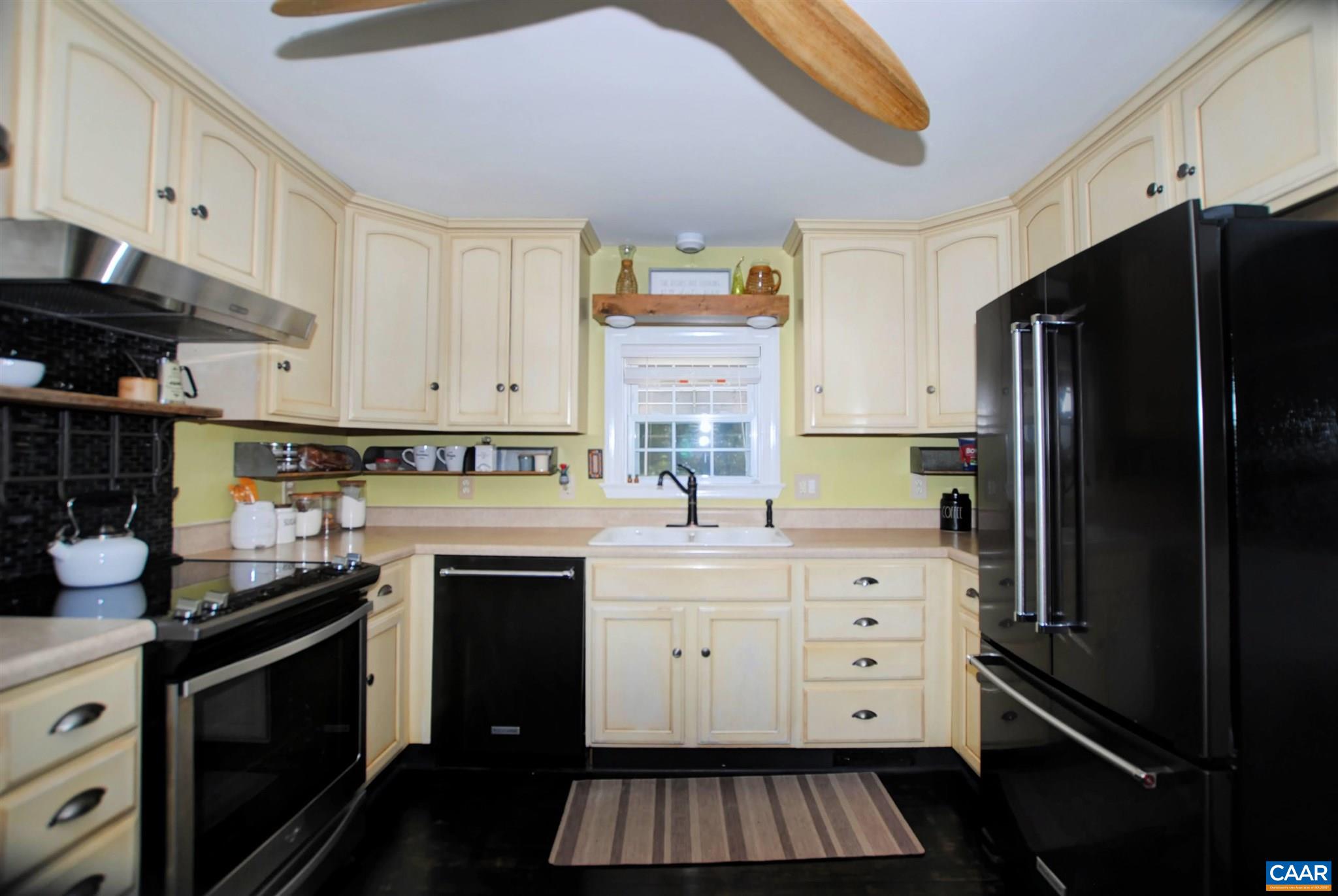 358 Fredericksburg Road Ruckersville, VA 22968 - Photo 8 of 23 a kitchen with stainless steel appliances a stove microwave and cabinets