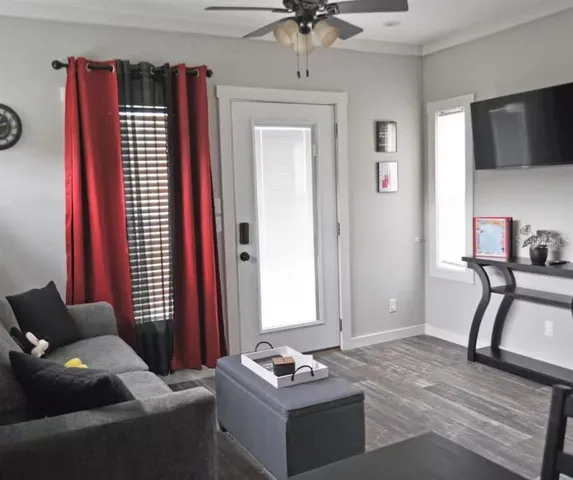 a living room with furniture and a window
