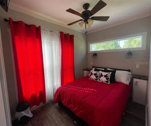 a bed room with a bed and a window