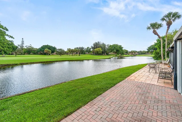 a view of a golf course with a lake view