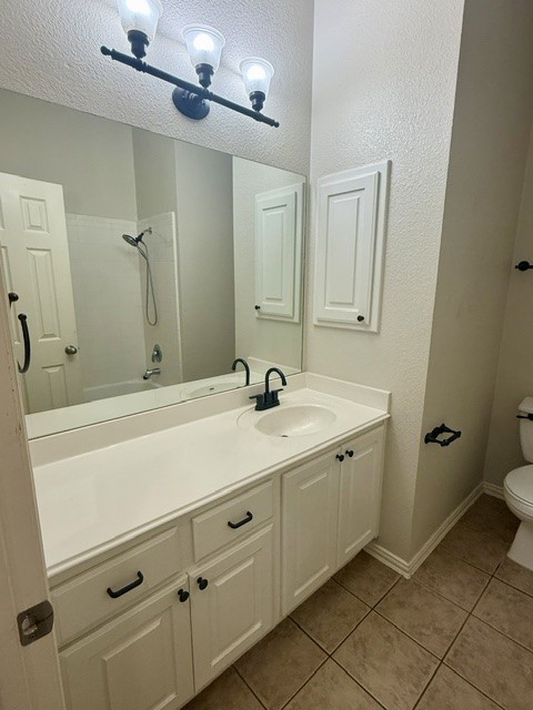 20724 Kearney Hill Road Pflugerville, TX 78660 - Photo 13 of 40 Bathroom featuring a white vanity with an integrated sink, black faucet, and white cabinetry