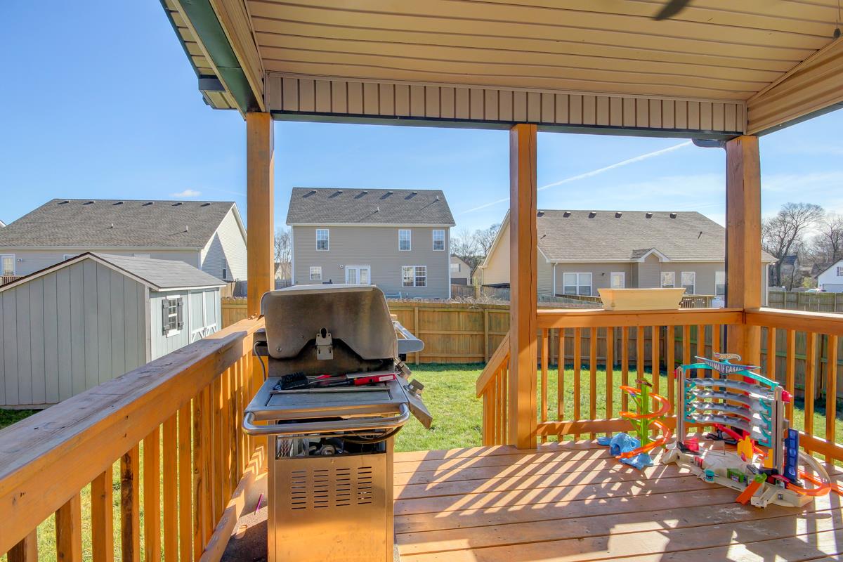3725 Suiter Road Clarksville, TN 37040 - Photo 14 of 15 a view of a balcony with wooden floor and furniture