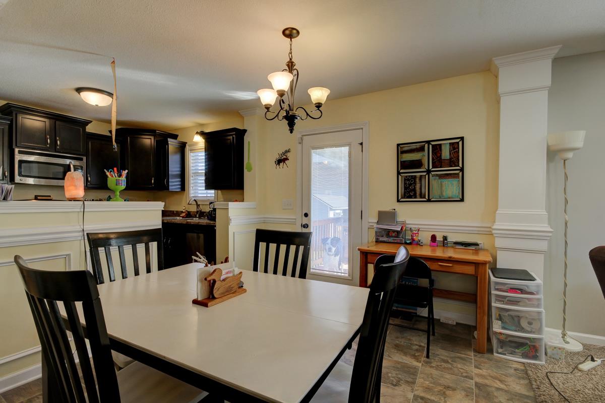 3725 Suiter Road Clarksville, TN 37040 - Photo 4 of 15 a view of a dining room with furniture and a chandelier