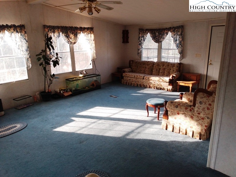 1240 East Big Springs Road Lansing, NC 28643 - Photo 14 of 24 a living room with furniture and a window