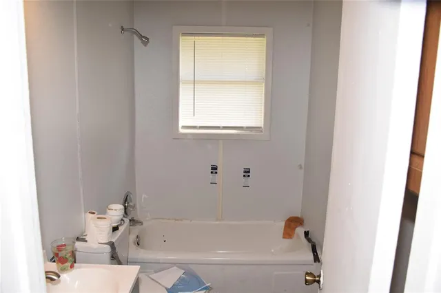 a view of an empty room with a window