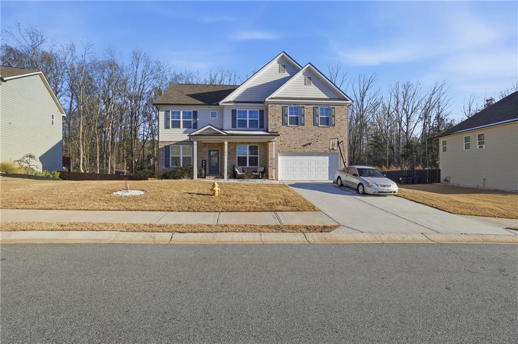 175 Paxton Lane Jefferson, GA 30549 - Photo 2 of 39 a front view of a house with a yard