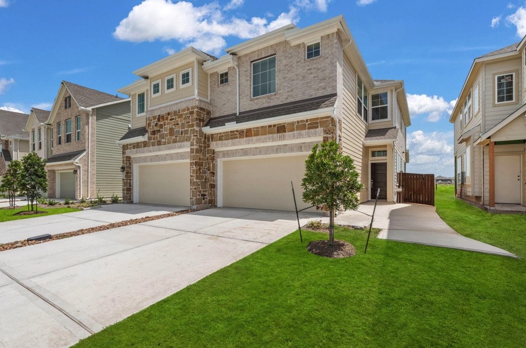 5234 Capricorn Way Manvel, TX 77578 - Photo 1 of 25 a view of a white house with a yard and plants