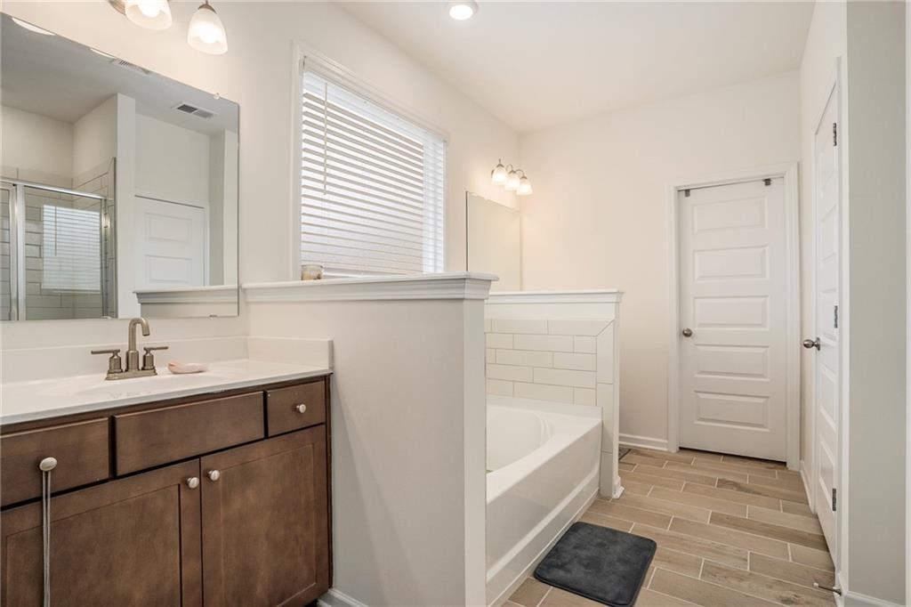 13709 Whitman Lane Covington, GA 30014 - Photo 18 of 36 a bathroom with a sink and a bathtub
