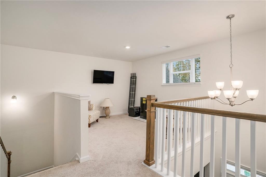 13709 Whitman Lane Covington, GA 30014 - Photo 22 of 36 a bedroom with furniture and a window