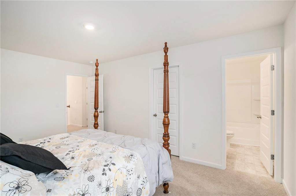 13709 Whitman Lane Covington, GA 30014 - Photo 25 of 36 a bedroom with a bed and a closet