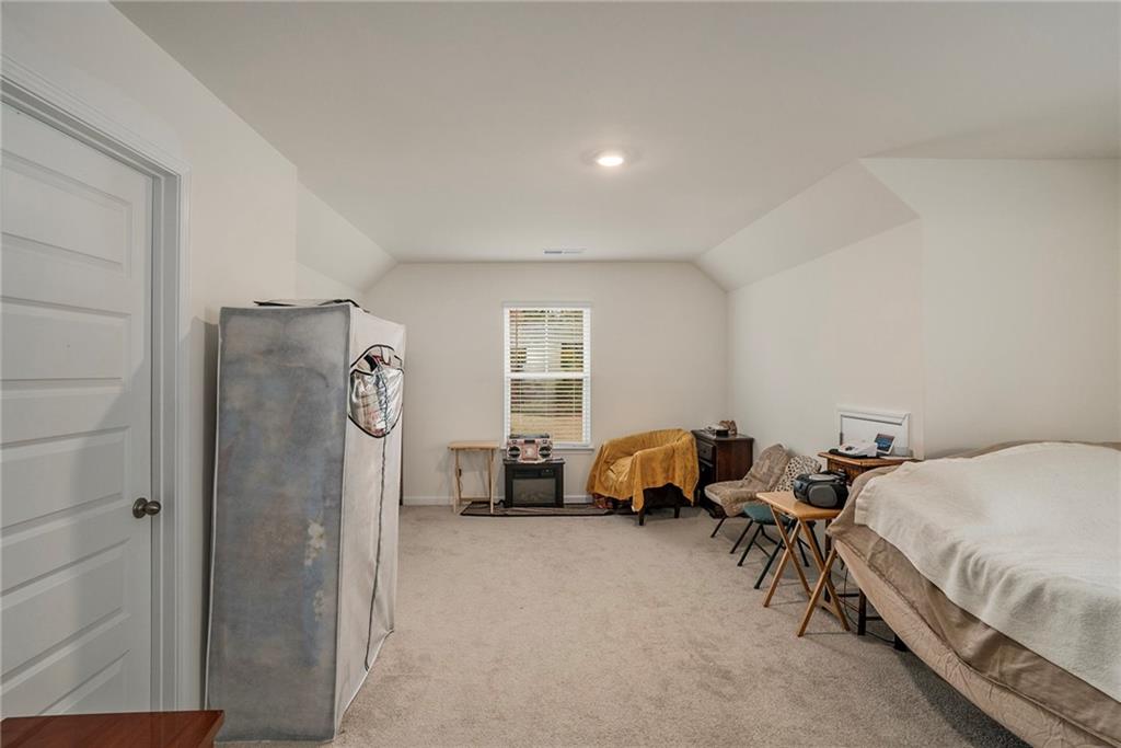 13709 Whitman Lane Covington, GA 30014 - Photo 32 of 36 a bedroom with a bed and a window