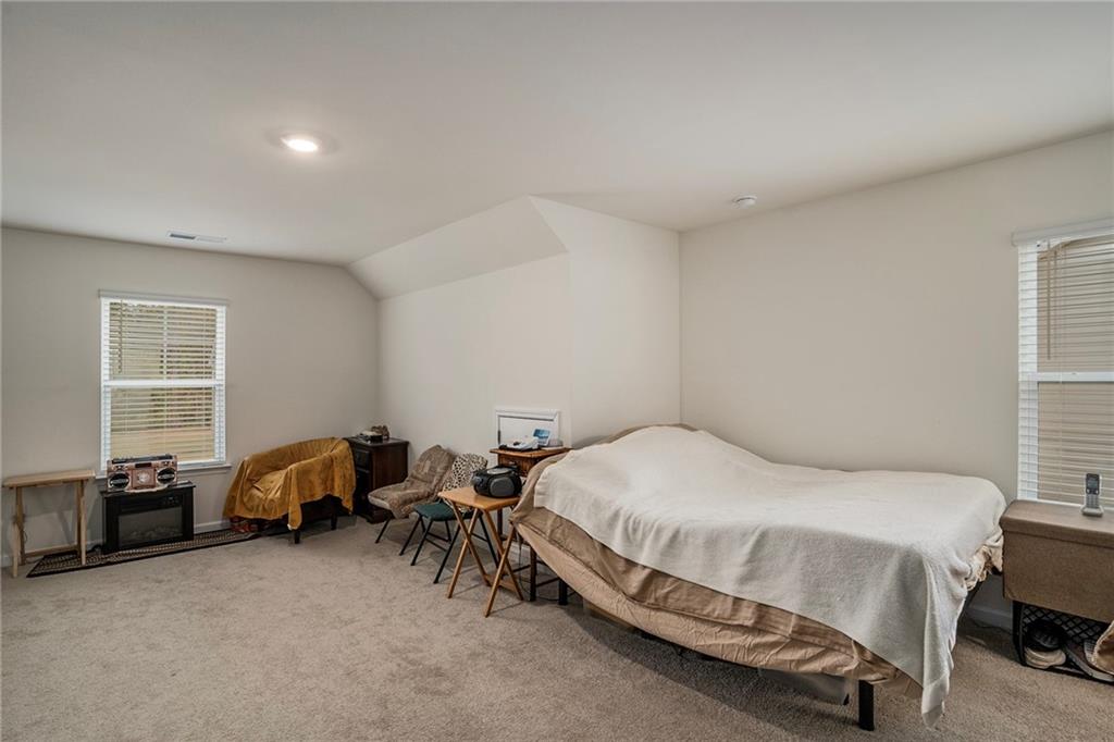 13709 Whitman Lane Covington, GA 30014 - Photo 33 of 36 a bedroom with a bed and a window